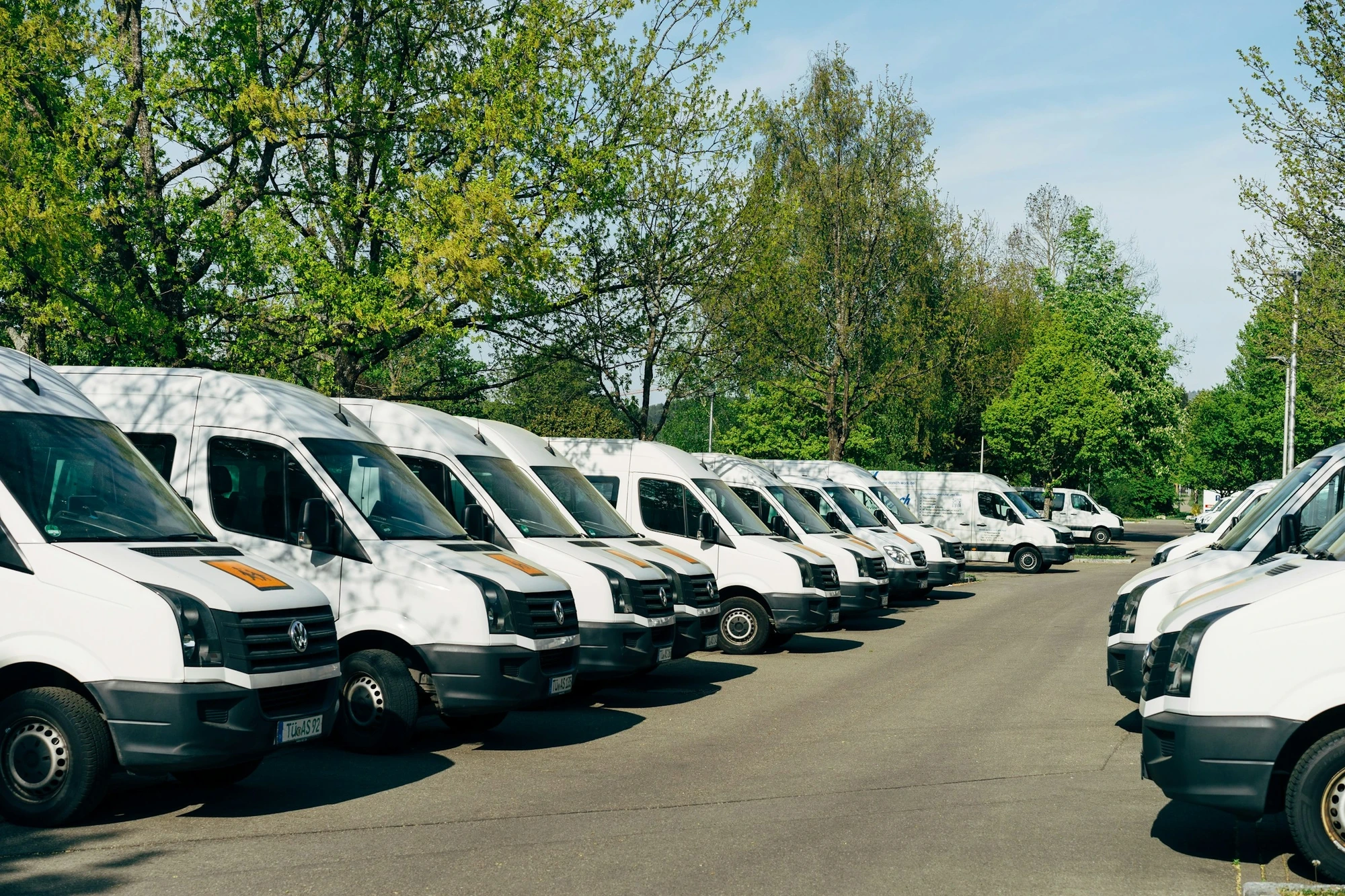 A fleet of commercial vehicles after being serviced by an auto glass shop.